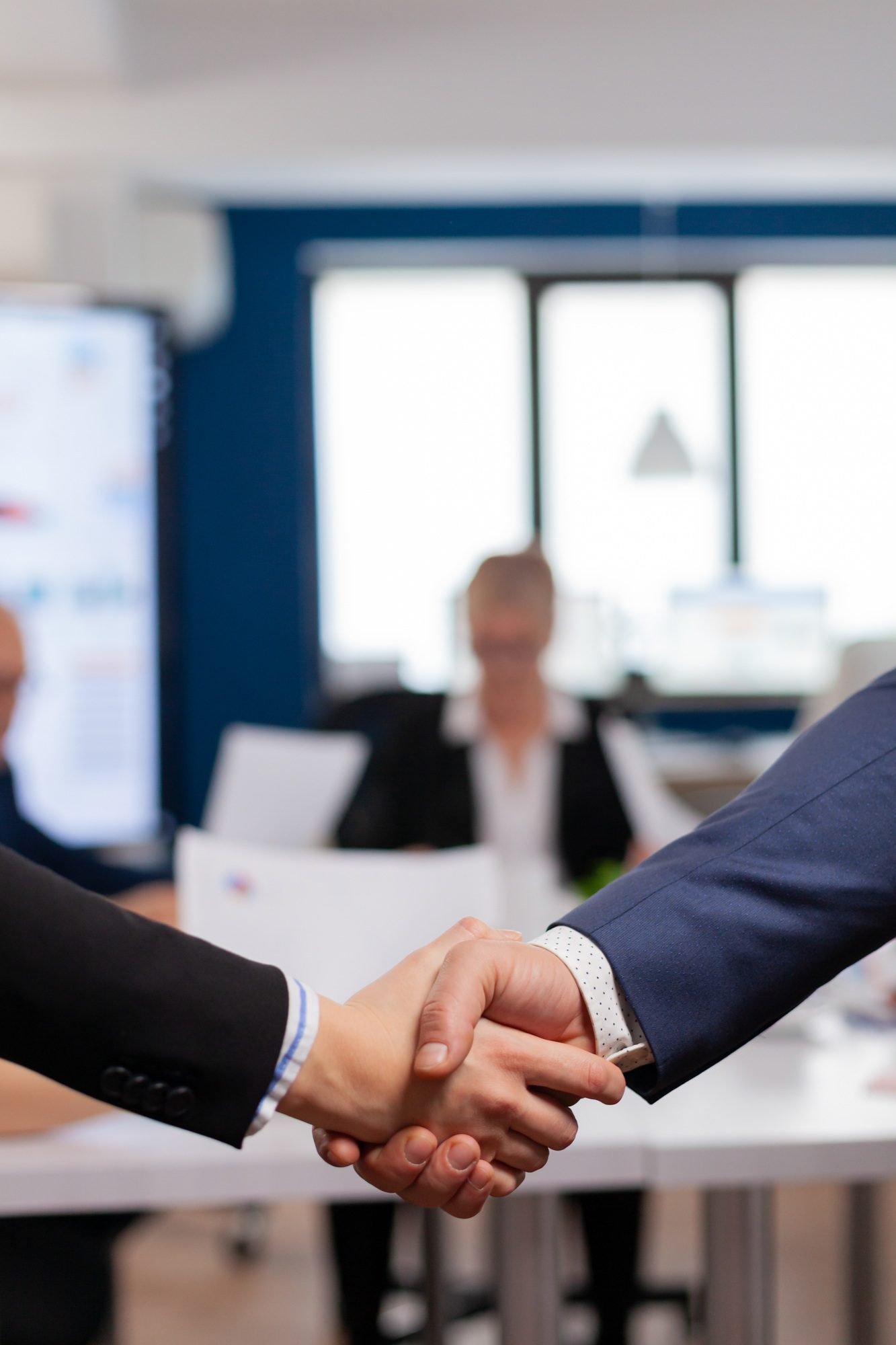 Satisfied businessman company employer wearing suit handshake